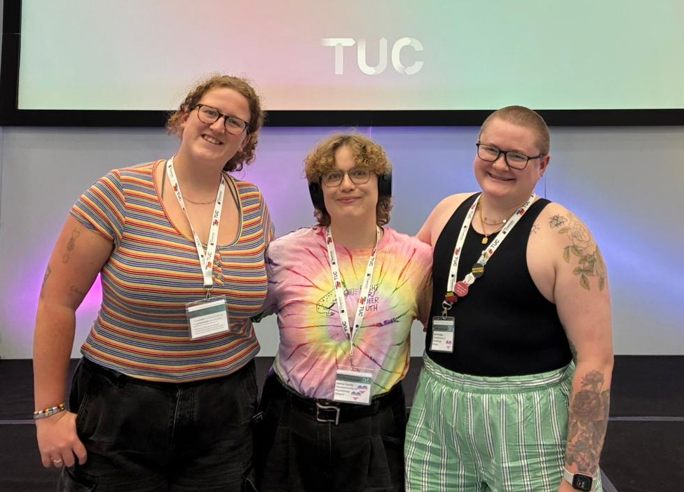The CSP members stood together in front of a screen which has written on it 'TUC LGBT+ Workers Conference 2026'