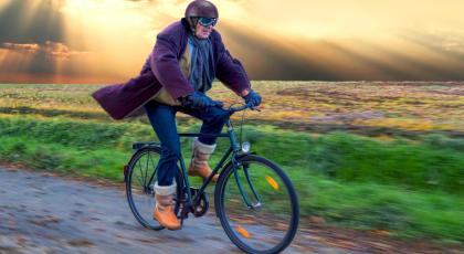 A man cycling through the countryside