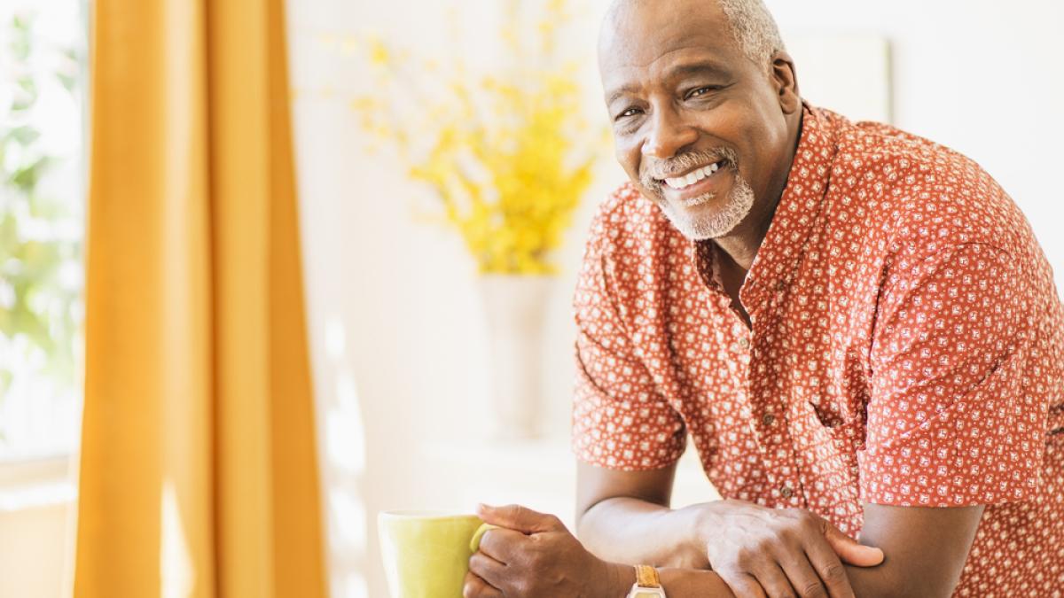 Smiling man with coffee cup