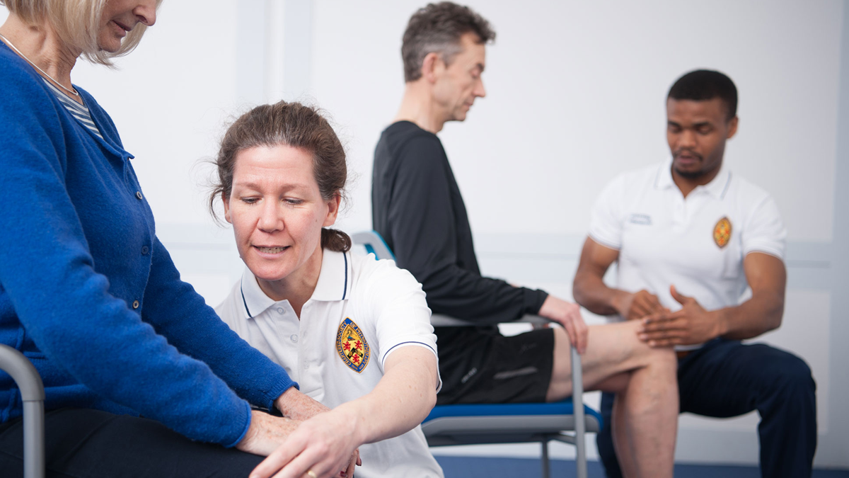 Physios doing routine checks on patients