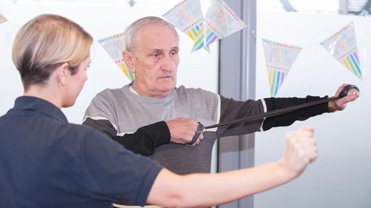 Stroke patient being shown rehab exercises