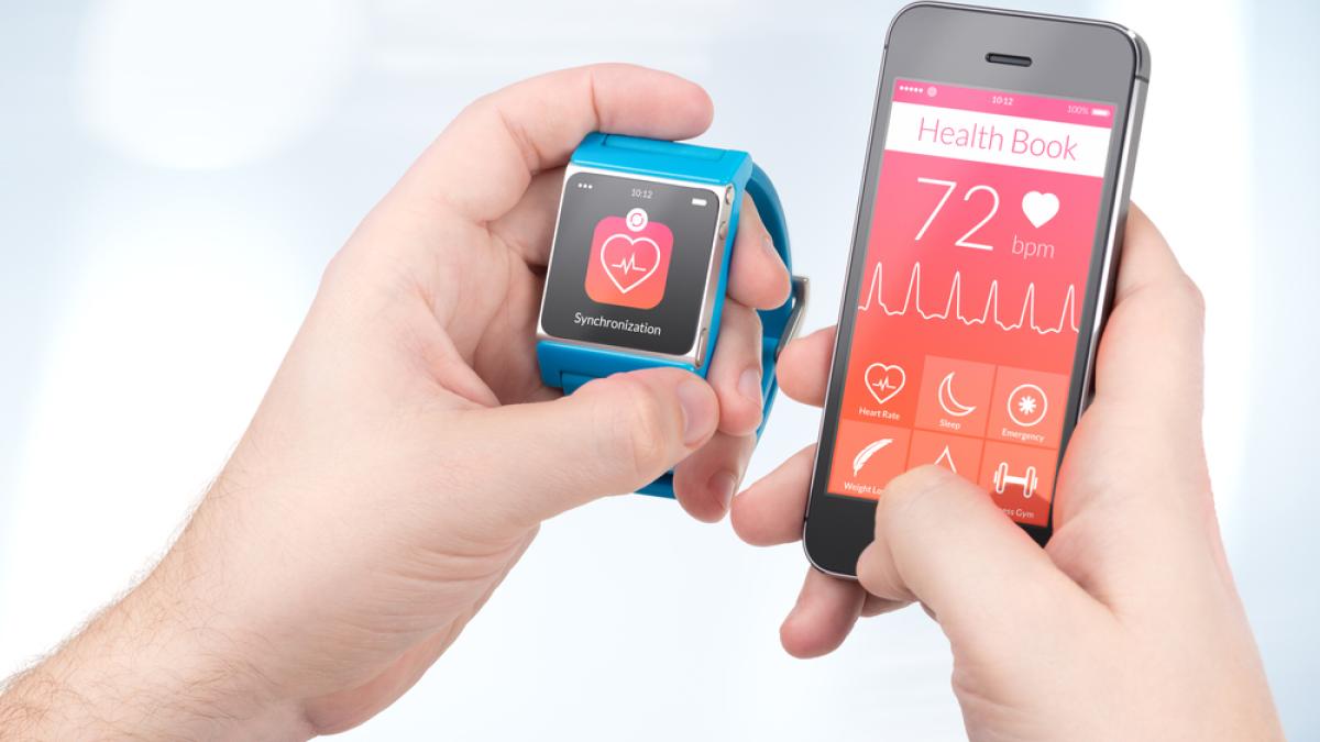 wearable tech a smartwatch syncing with a phone