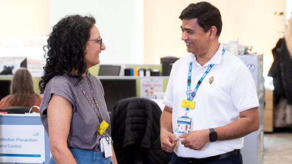 FLJul26Cover Subash Sivarasu talks with head of Hillingdon Community Services for adults Rakhee Prema at Beaufort House [Photos: Nathan Clarke]