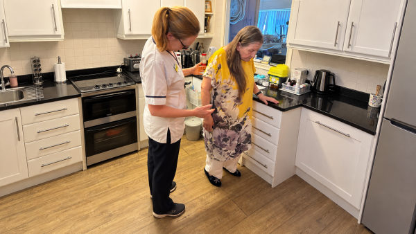 Physiotherapist supervises balance exercises