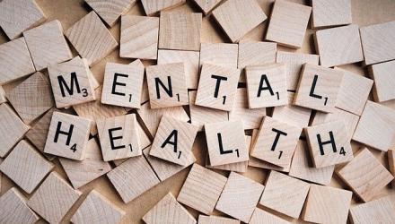 mental health spelled out in scrabble tiles
