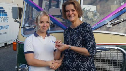 Physiotherapist Anna Goodman receives an appreciation badge from Chief Allied Health Professions Officer Suzanne Rastrick 