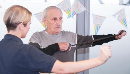 Stroke patient being shown rehab exercises