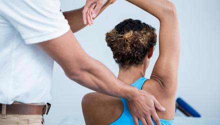 A physiotherapist treats a patient with a musculoskeletal condition. 
