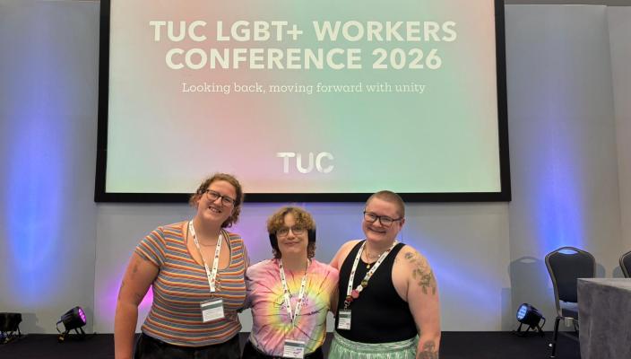 The CSP members stood together in front of a screen which has written on it 'TUC LGBT+ Workers Conference 2026'