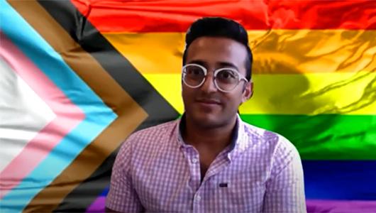 CSP LGBTQIA+ network convenor Sudhir Daya, against the backdrop of a Pride flag