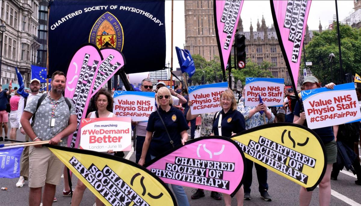 marchers holding CSP banners in front of Big Ben