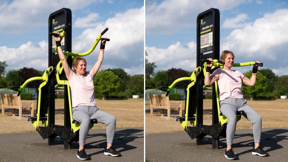 Photograph of a woman using a shoulder press at the park