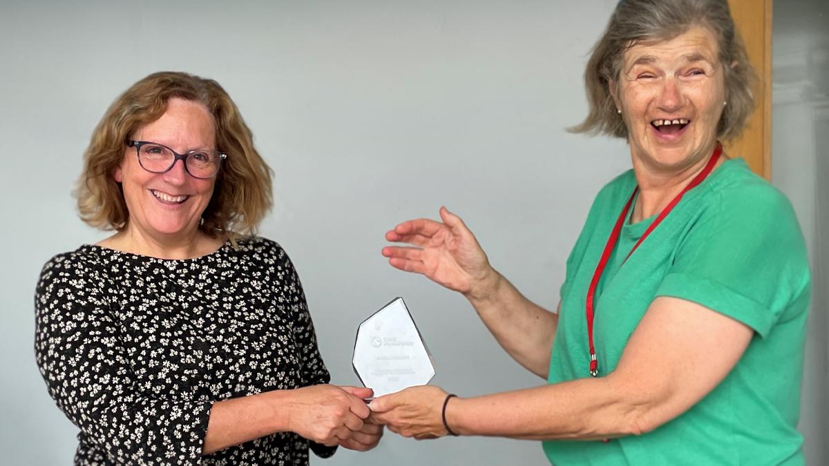 Nicola Phillips, pictured left, being presented with her award by a colleague who attended the congress