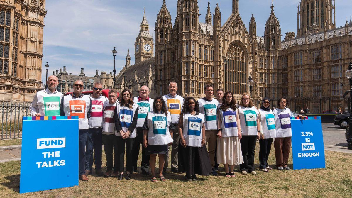 Union representatives deliver a letter to the government in Westminster on pay
