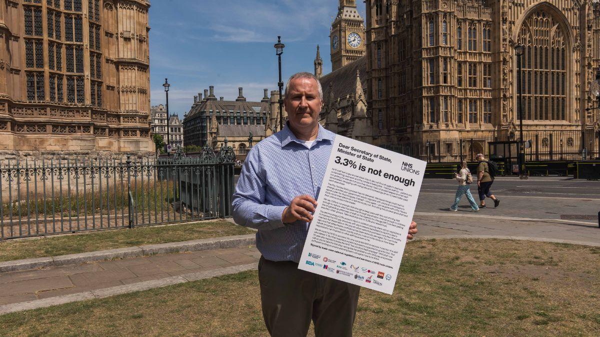 Jim Fahie delivers the joint union letter on pay in Westminster